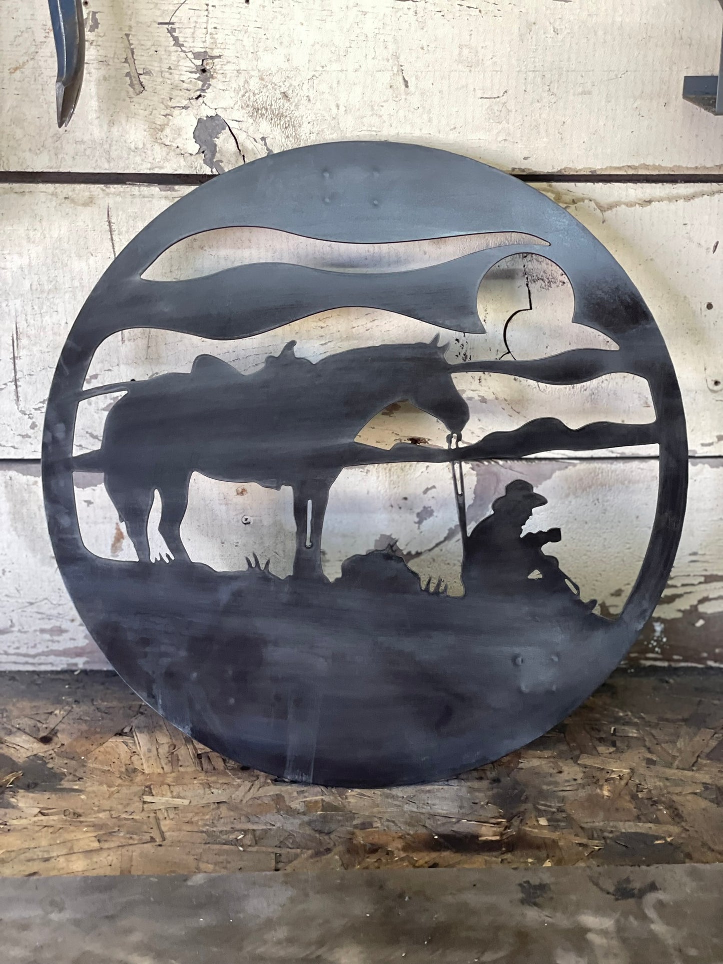 "Metal sign featuring a cowboy drinking coffee with his horse, rustic western design with patina finish, vintage country decor for home or ranch style."