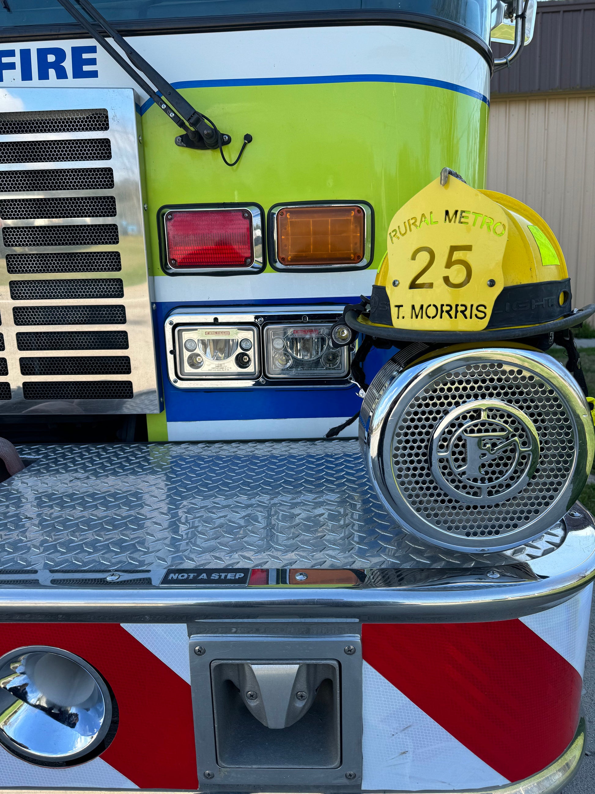 "Custom powder coated metal firefighter helmet shield with personalized engravings, durable and stylish firefighter accessory, perfect for displaying department name, unit number, and name."